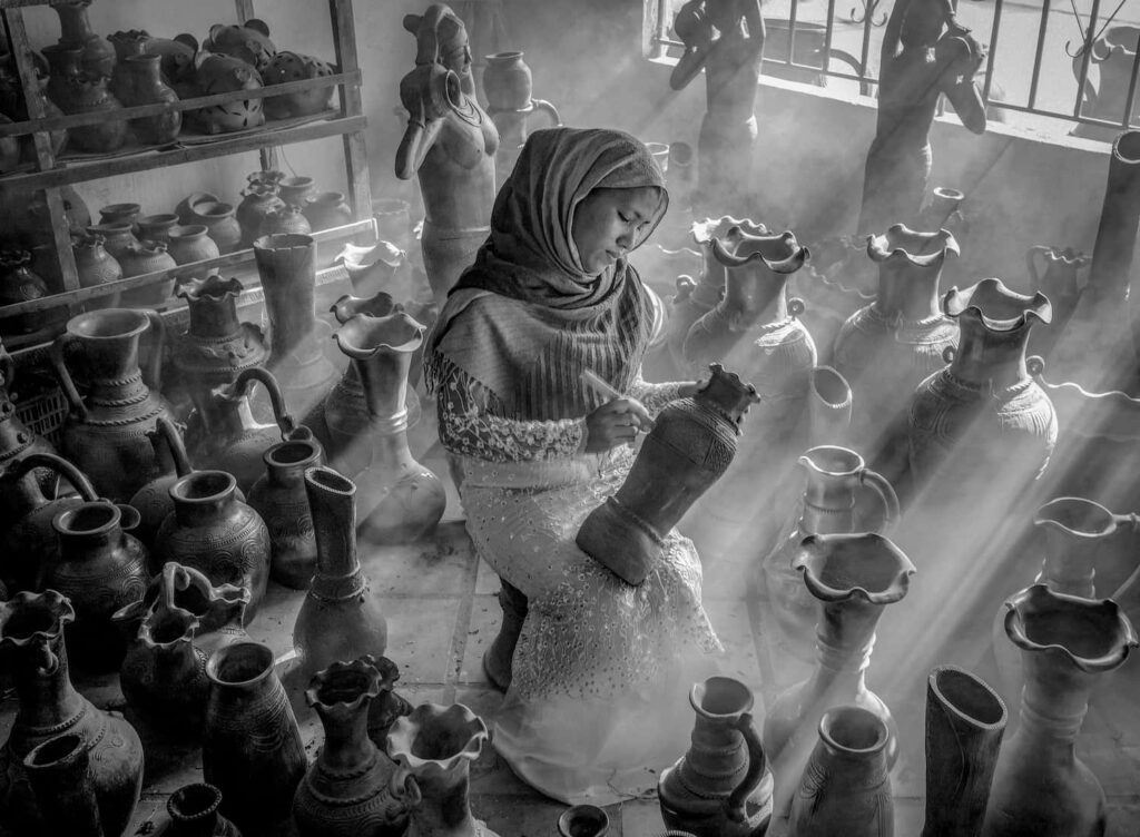 Pottery village girl, by Van Dong Nguyen, Portrait Category Winner in the Black and White Photo Awards 2024