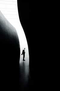 Between Darkness and Light, by Marco Wilm - Street Bronze Mention in the Black and White Photo Awards 2025